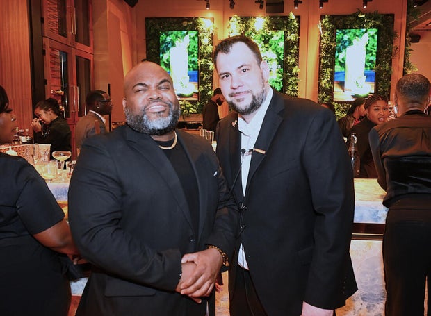 People post for a photo at the opening of Kitchen + Kocktails, a restaurant in Philadelphia