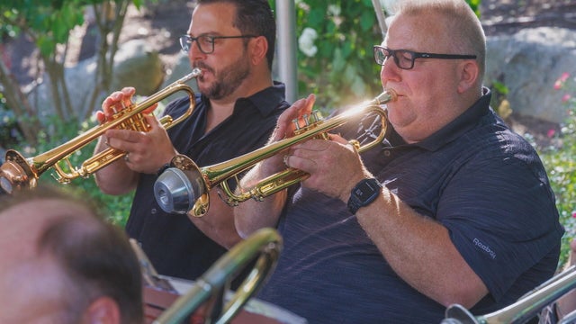 Two members of the Philly pops play the trumpet 