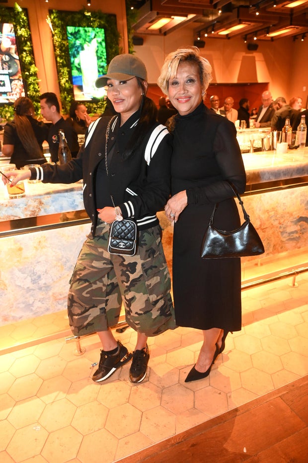 People post for a photo at the opening of Kitchen + Kocktails, a restaurant in Philadelphia