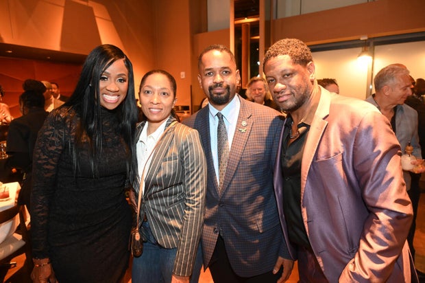 People post for a photo at the opening of Kitchen + Kocktails, a restaurant in Philadelphia