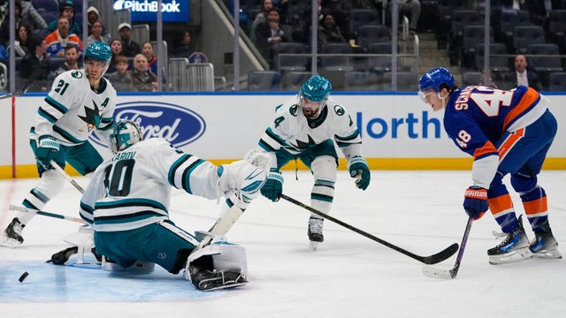 New York Islanders' Matthew Schaefer (48) shoots the puck past San Jose Sharks goaltender Yaroslav Askarov (30) for a goal during the second period of an NHL hockey game Tuesday, Oct. 21, 2025, at UBS Arena in Elmont, N.Y. 