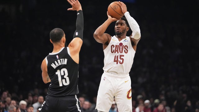 Cleveland Cavaliers' Donovan Mitchell (45) shoots over Brooklyn Nets' Tyrese Martin (13) during the first half of an NBA basketball game Friday, Oct. 24, 2025, at Barclays Center in New York.