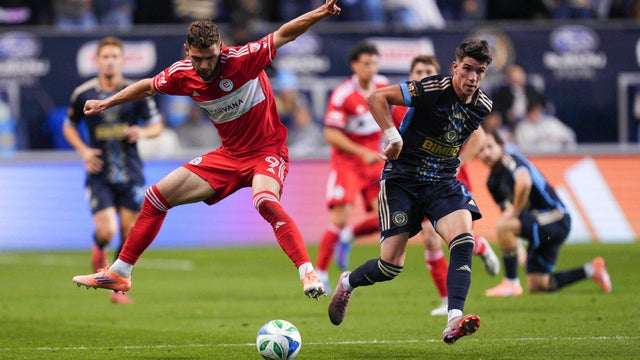 Chicago Fire's Hugo Cuypers, left, plays the ball past Philadelphia Union's Jovan Lukic, right, in the first half of Game 1 in the first round of MLS soccer's Eastern Conference playoffs at Subaru Park in Chester