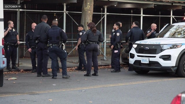 NYPD officers standing in a street