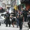 Raid on gang in Rio leaves at least 64 people dead, including police officers