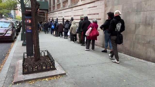 Line of people waiting at a food pantry 