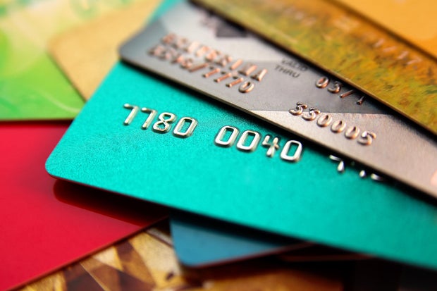 stack of multicolored credit cards, close up view with selective focus 
