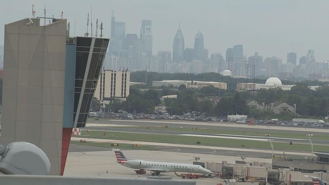 Philadelphia skyline is seen behind an air traffic control tower at the airport 