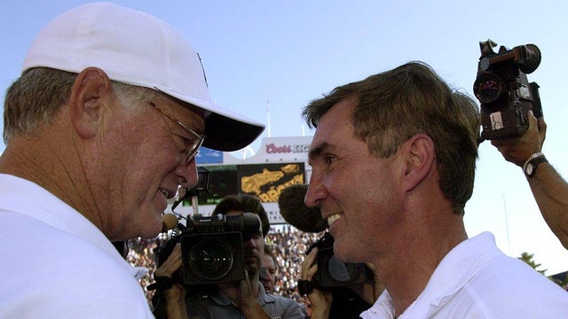 DENVER, CO--BRONCOS vs FALCONS--Atlanta Falcons coach Dan Reeves meets with broncos coach Mike Shanahan at mid field after the Broncos win over the Falcons 42-14 for the Broncos first regular season win.THE DENVER POST/JOHN LEYBA 2000 DIGITAL FILE 