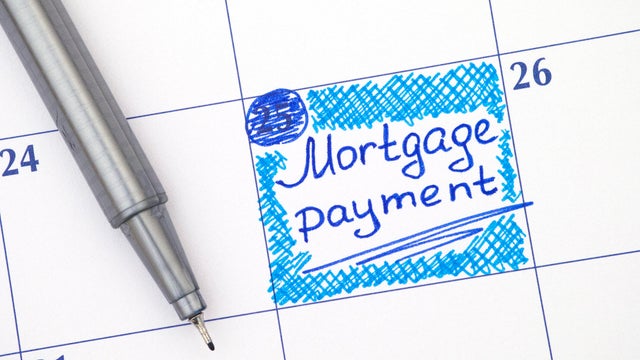 Reminder Mortgage Payment in calendar with blue pen 