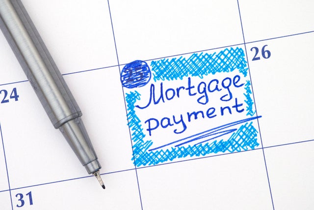 Reminder Mortgage Payment in calendar with blue pen