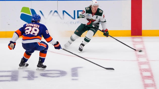 Minnesota Wild Right Wing Kirill Kaprizov (97) controls the puck against New York Islanders Defenseman Alexander Romanov (28) during the second period of the National Hockey League game between the Minnesota Wild and the New York Islanders on November 7, 2025, at UBS Arena in Elmont, NY. 
