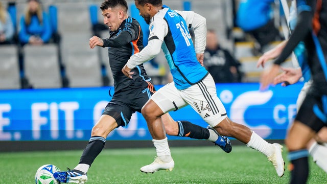 Nicolás Fernández #7 of New York City FC dribbles the ball while defended by Nathan Byrne #14 of Charlotte FC in the first half during their game at Bank of America Stadium on November 07, 2025 in Charlotte, North Carolina. 