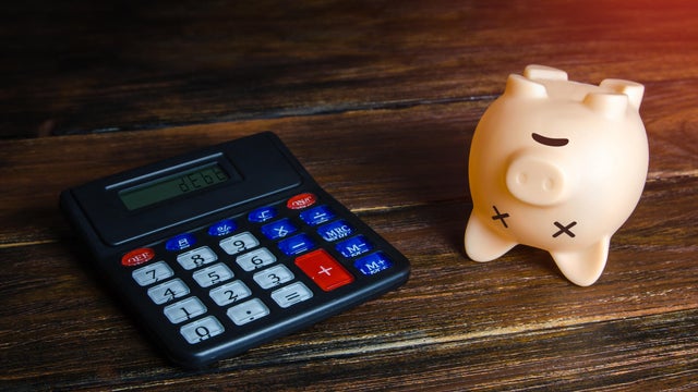 Debts and depleted savings. Dead empty piggy bank. Bankruptcy and business closure due economic crisis. Refinancing and restructuring of debts, reduction of losses. Debt cancellation 