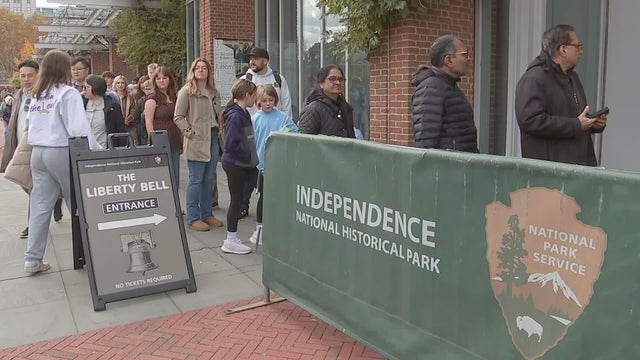 People are in line to enter Independence National Historical Park in Philadelphia, including the Liberty Bell 