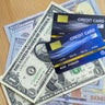Credit cards and dollars in cash 