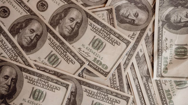 Close up many dollar bills on the table 