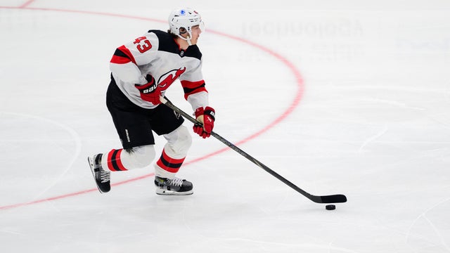 New Jersey Devils defenseman Luke Hughes (43) skates with the puck during the NHL game between the Washington Capitals and the New Jersey Devils on November 15, 2025, at Capital One Arena in Washington, DC. 
