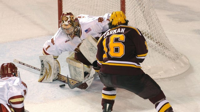 Denver center Brian Gifford (22) faced off against Gophers center Patrick White (7). The Denver Pioneers hockey team hosted the Minnesota Gophers Friday night, February 12, 2010 at Magness Arena. Karl Gehring, The Denver Post 