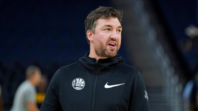 FILE - Golden State Warriors assistant coach Chris DeMarco stands before an NBA preseason basketball game against the Denver Nuggets in San Francisco, Oct. 14, 2022. 