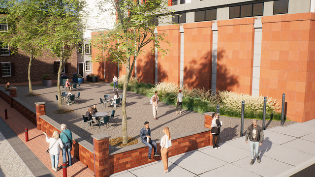 A rendering of the park planned near Elfreth's Alley, it's paved and has some tables and trees 