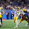 Love matches career high with 4 TD passes, lifting Packers to win over Lions 