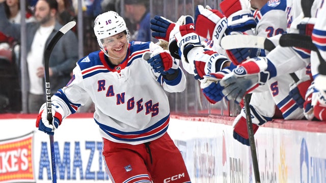 Left Wing Artemi Panarin #10 of the New York Rangers fist bumps teammates after scoring during the NHL game between the New York Rangers and the Carolina Hurricanes on November 26, 2025 at Lenovo Center in Raleigh, North Carolina. 