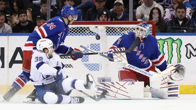 Igor Shesterkin #31 of the New York Rangers makes the second period save against Brandon Hagel #38 of the Tampa Bay Lightning at Madison Square Garden on November 29, 2025 in New York City. 