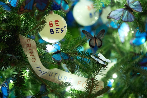 Ornaments hang from a Christmas tree in the Red Room of the White House