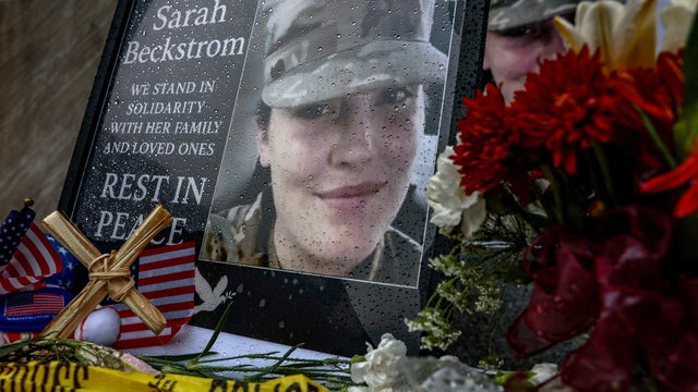 A makeshift memorial honors slain West Virginia National Guard member Sarah Beckstrom, who was shot with fellow guard member Andrew Wolfe outside a subway station near the White House, in Washington, D.C., Dec. 2, 2025. 