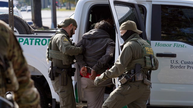 People walk on Bourbon Street in New Orleans on Nov. 29, 2025. 