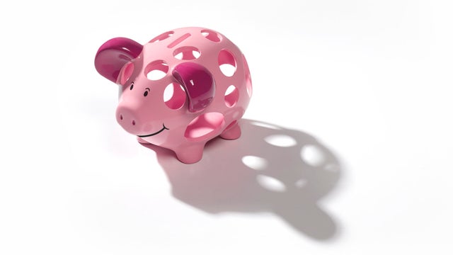 Holey piggy bank with copy space 