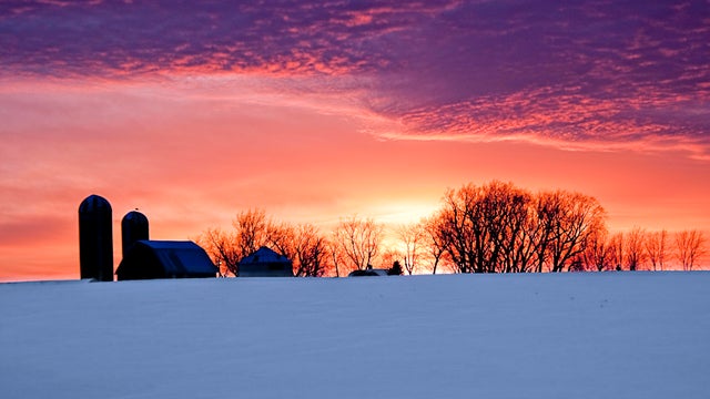 Silhouette farm sunset snow 