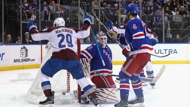 Nathan MacKinnon #29 of the Colorado Avalanche scores a third period goal against Igor Shesterkin #31 of the New York Rangers at Madison Square Garden on December 06, 2025 in New York City. 