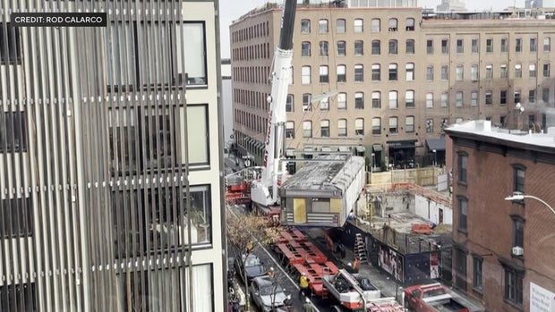 A diner being hoisted into the air by a crane
