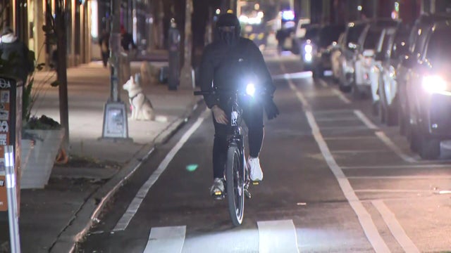 Cyclist in a bike lane at night 