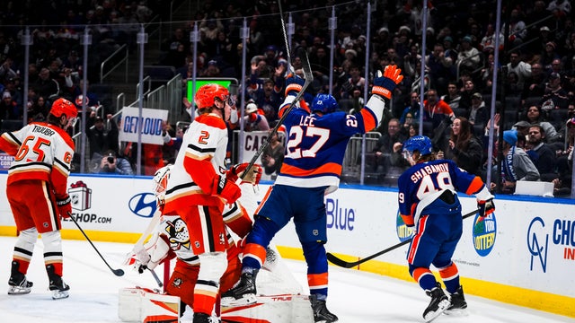 Anders Lee #27 of the New York Islanders celebrates with his teammates after scoring his second goal in the first period against the Anaheim Ducks at UBS Arena on December 11, 2025 in Elmont, New York. 