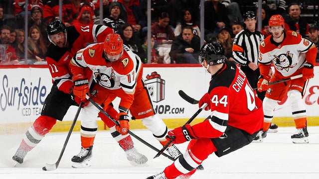 Alex Killorn #17 of the Anaheim Ducks competes for the puck with Stefan Noesen #11 of the New Jersey Devils during the first period at Prudential Center on December 13, 2025 in Newark, New Jersey. 