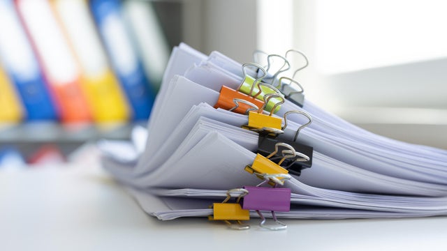Heap of documents clipped with clips 