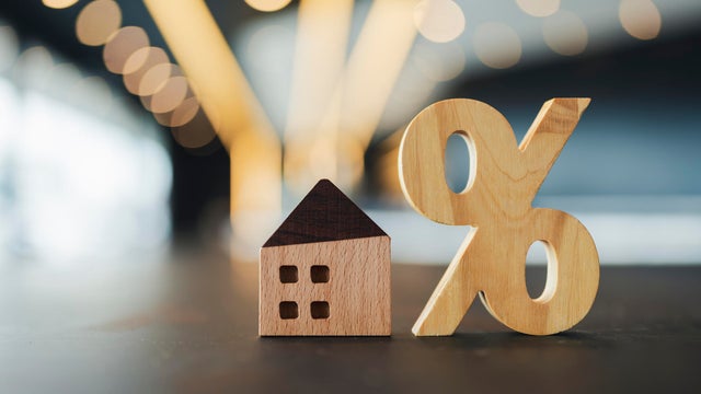 Close-up shot of a real estate agent giving a young Asian woman the keys to her new home. Home ownerships concepts 