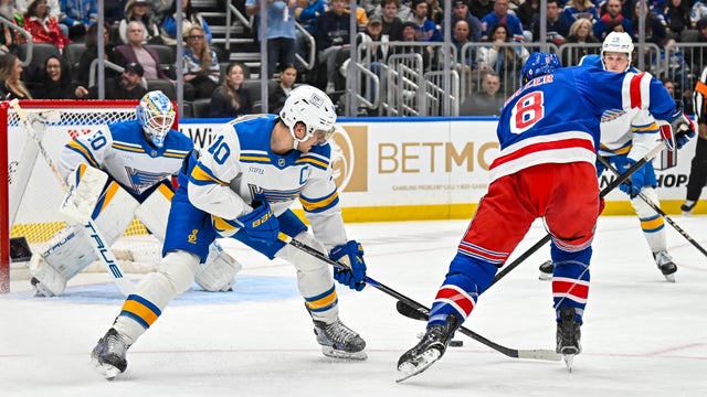 ew York Rangers center J.T. Miller (8) slips around the stick check of St. Louis Blues center Brayden Schenn (10) during a game where the St. Louis Blues hosted the New York Rangers on Thursday December 18, 2025, at the Enterprise Center in St. Louis MO 