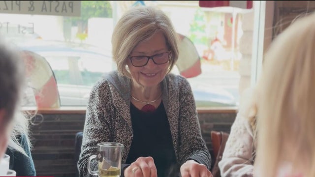 A woman with glasses sitting at a table at restaurant Mio Vicino 
