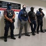 Federal law enforcement officers stand outside immigration courtrooms at the Javits Federal Building in New York on Nov. 21, 2025. 
