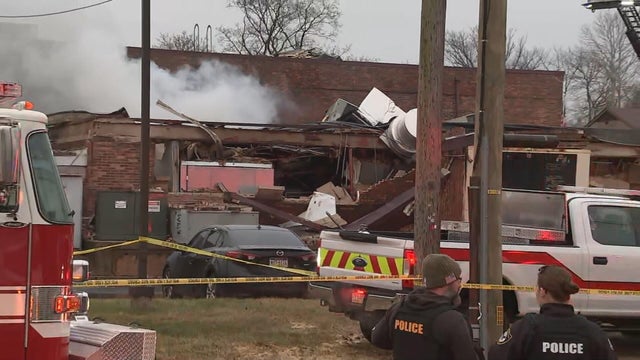 Damaged building, emergency vehicles 