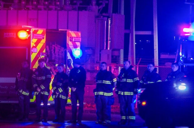 Firefighters line up during a procession for the slain Delaware trooper 