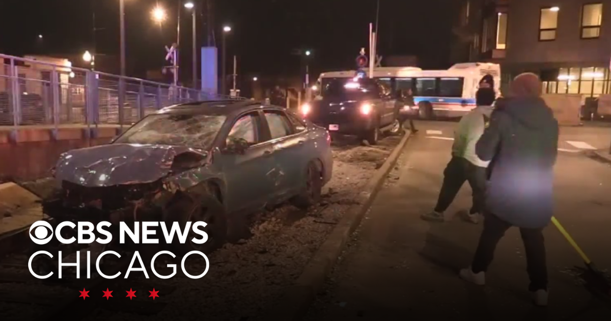 Car crashes through building in South Shore - CBS Chicago