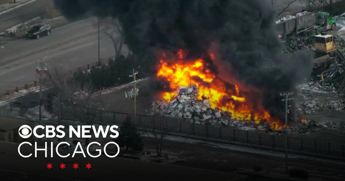 Fire burning in scrap yard on West Side of Chicago - CBS Chicago