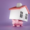 Flattened pink piggy bank carry a toy house on its back on a purple background. Illustration of the concept of the burden of mortgage loans and heavy debt 