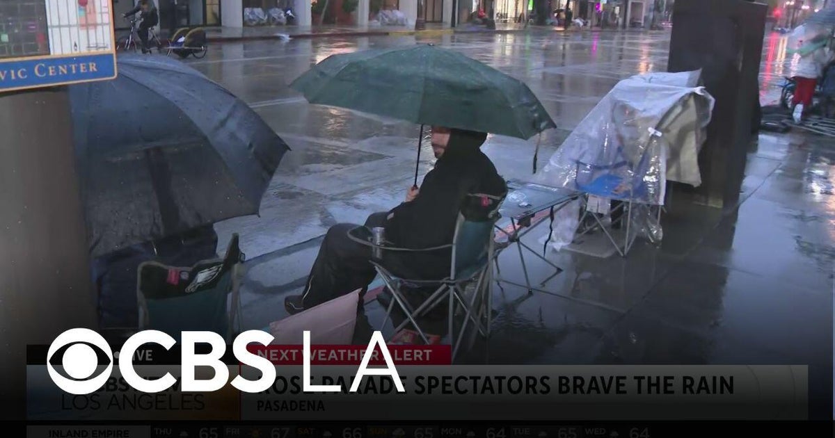 Rose Parade goers brave the rainy morning ahead of the event - CBS Los ...