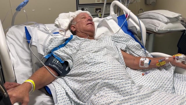 Julio Figueroa laying in a hospital bed 